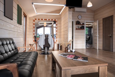 Photo of Stylish barbershop interior with hairdresser's workplace and modern furniture