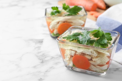 Photo of Delicious chicken aspic on white marble table. Space for text