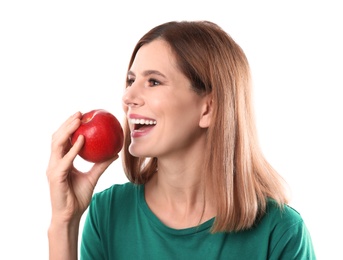 Photo of Smiling woman with perfect teeth and red apple on white background