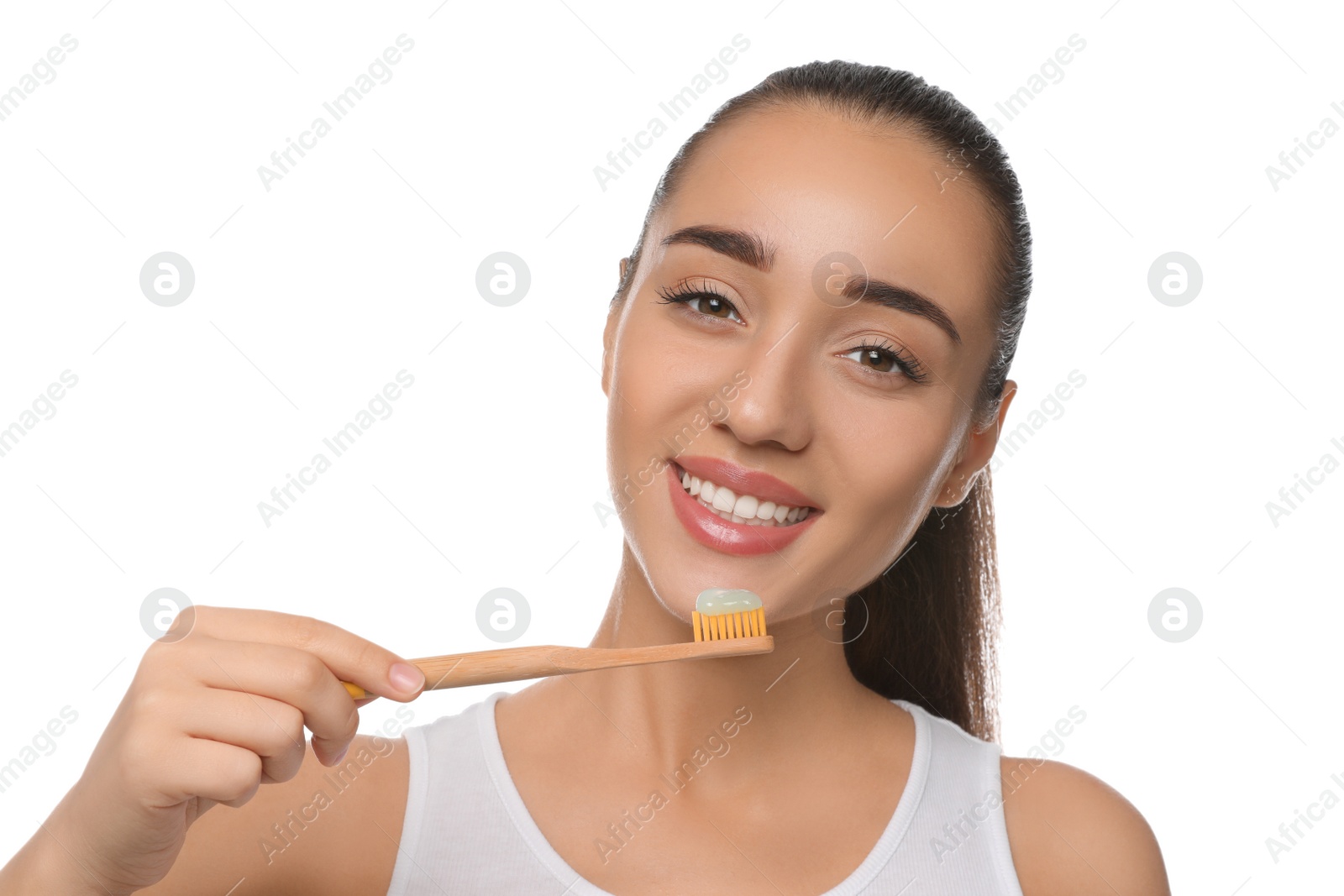 Photo of Woman holding toothbrush with paste on white background