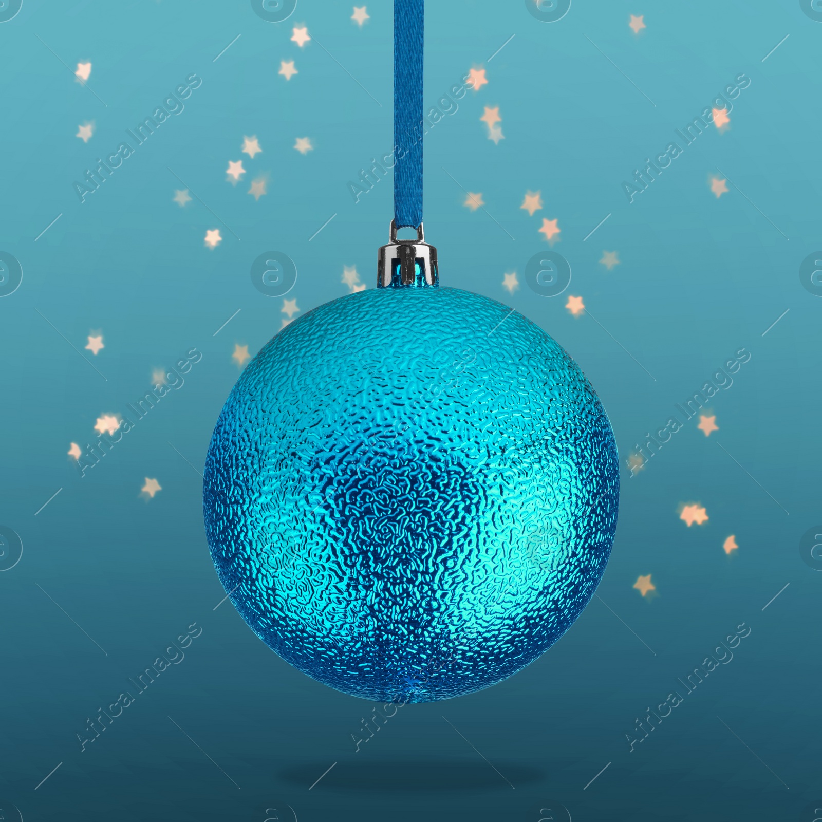 Image of Beautiful Christmas ball hanging on blue background