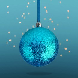 Image of Beautiful Christmas ball hanging on blue background