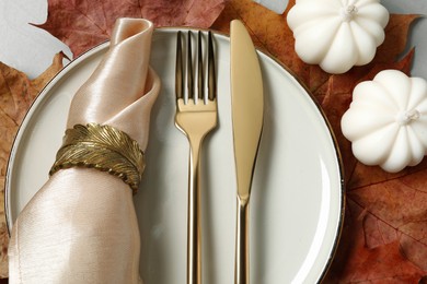 Photo of Happy Thanksgiving day. Beautiful table setting and autumn decoration on light grey background, flat lay