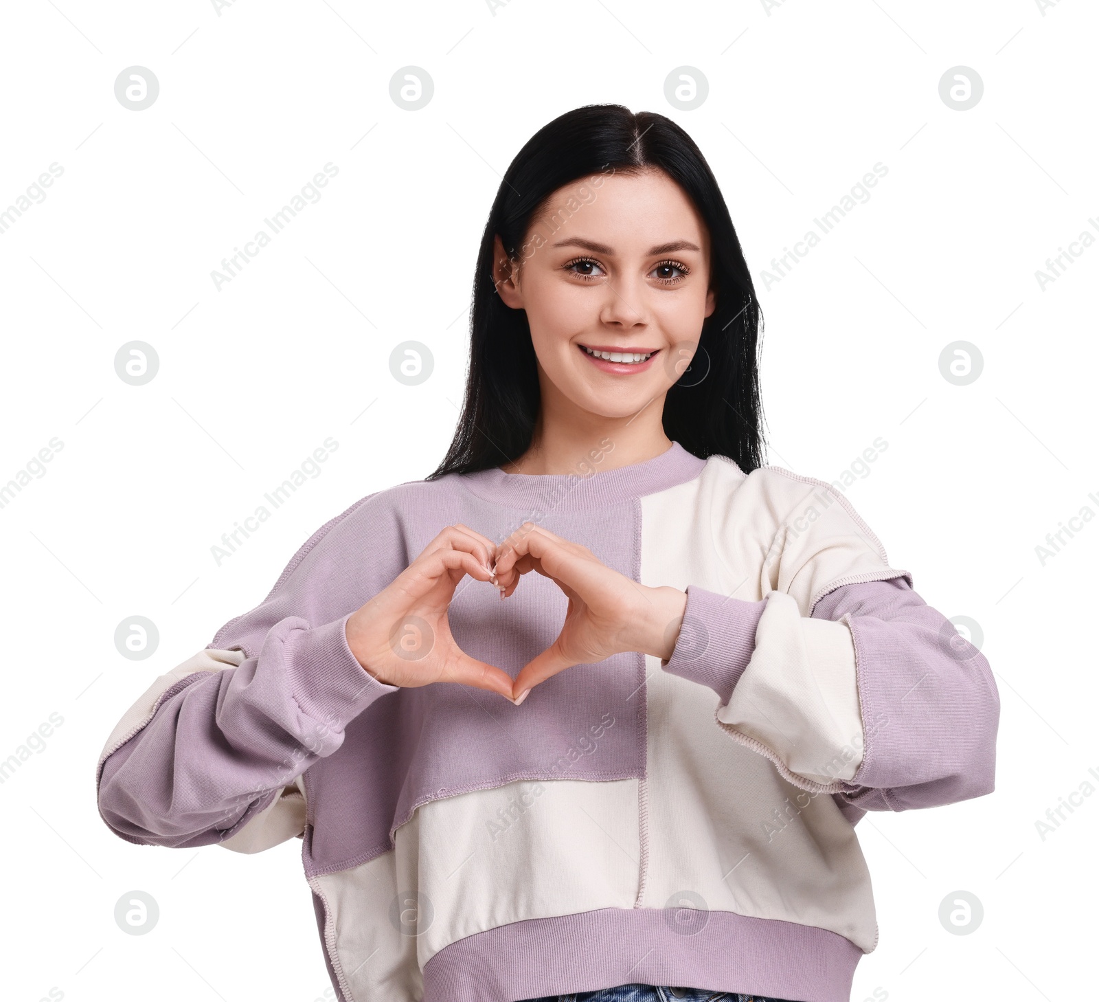 Photo of Smiling woman showing heart gesture with hands on white background