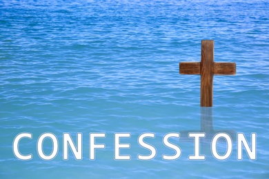 Word Confession near wooden Christian cross in water