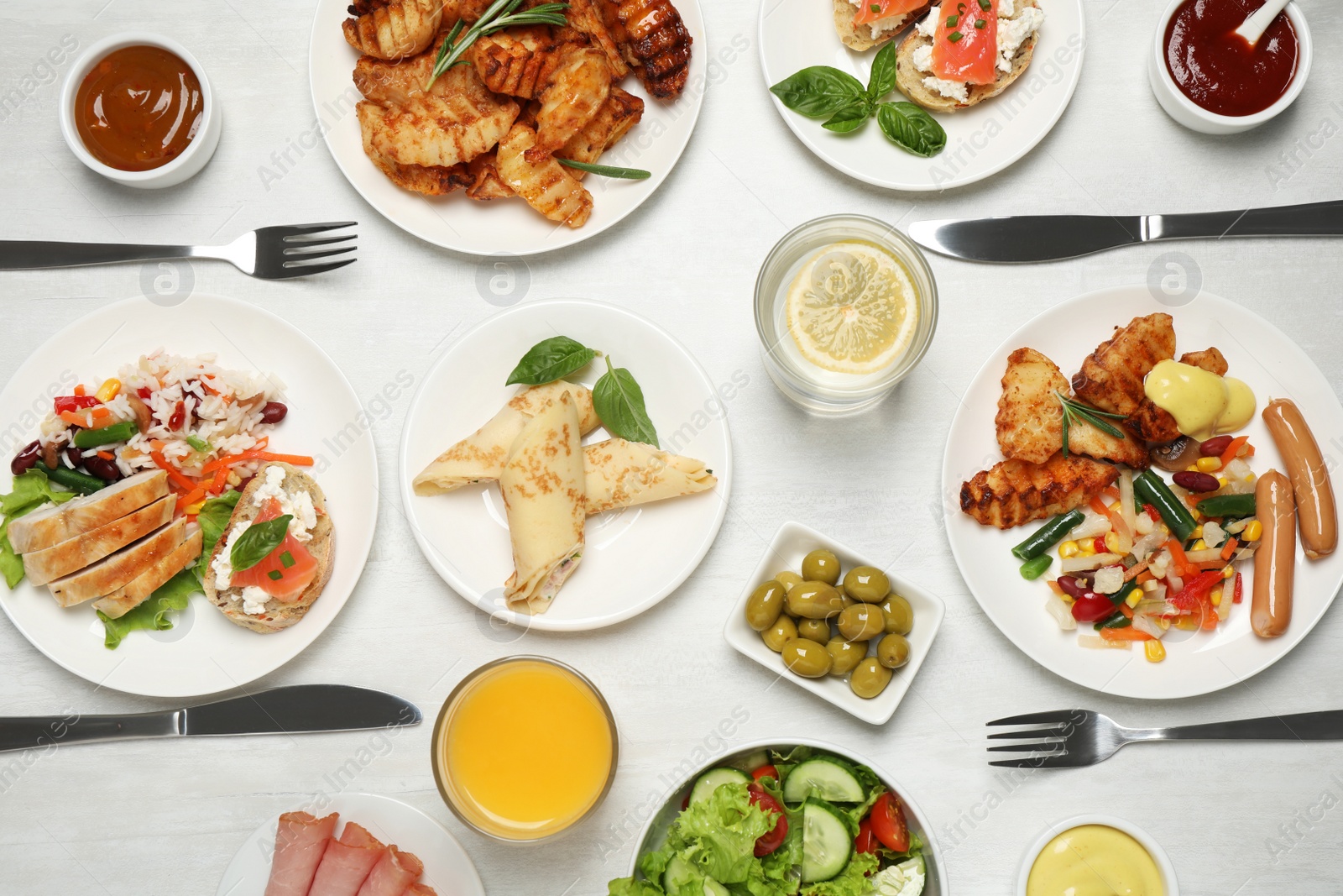 Photo of Buffet service. Many different dishes on white wooden table, flat lay