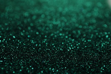 Shiny green glitter as background. Bokeh effect