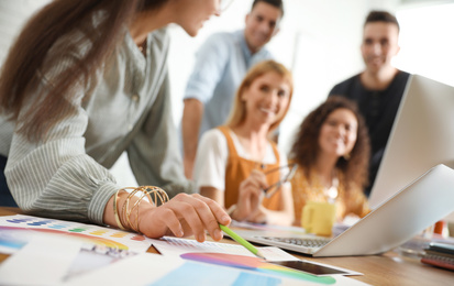 Team of professional designers working in office, closeup