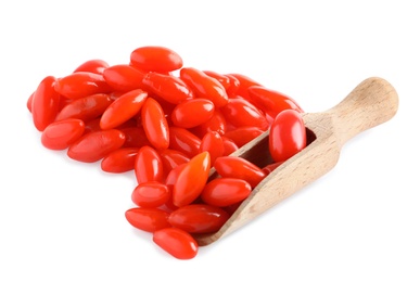 Photo of Fresh ripe goji berries and wooden scoop on white background