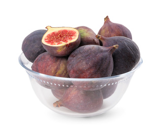 Photo of Whole and cut tasty fresh figs in glass bowl isolated on white