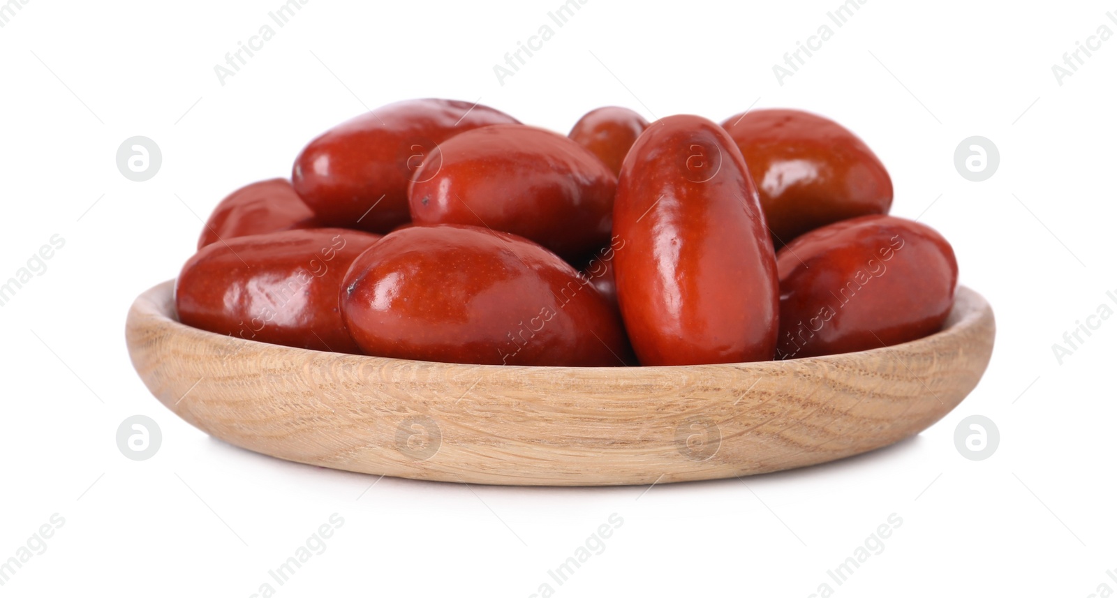 Photo of Wooden plate of ripe red dates on white background