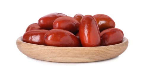 Photo of Wooden plate of ripe red dates on white background