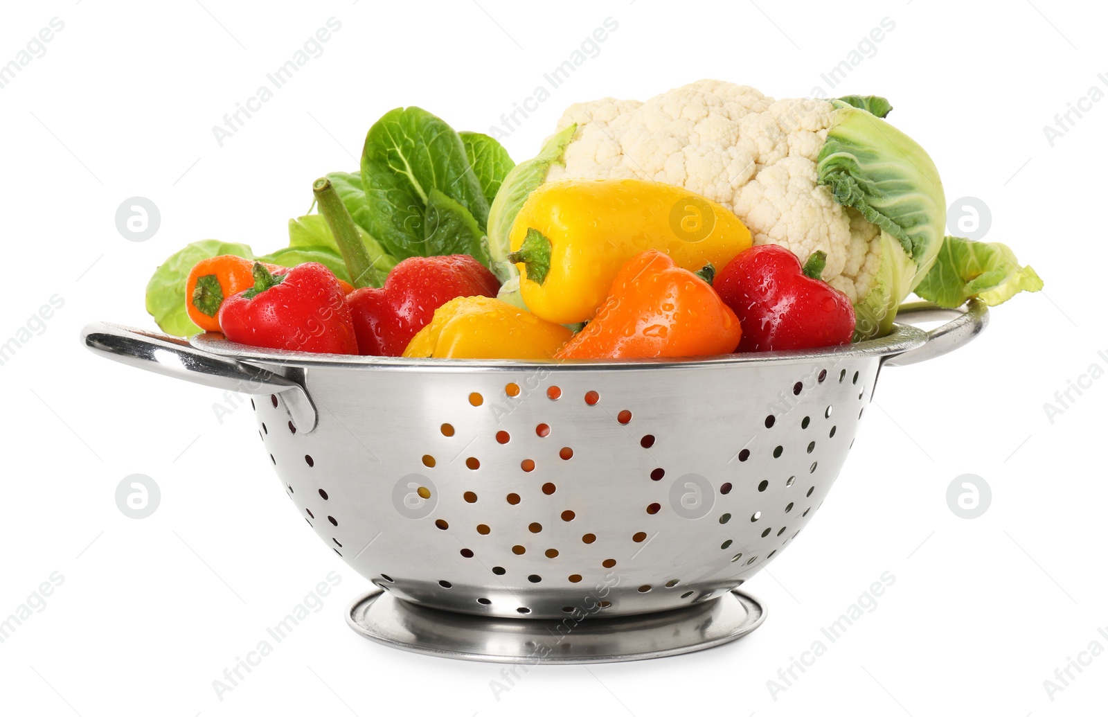 Photo of Metal colander with different vegetables isolated on white