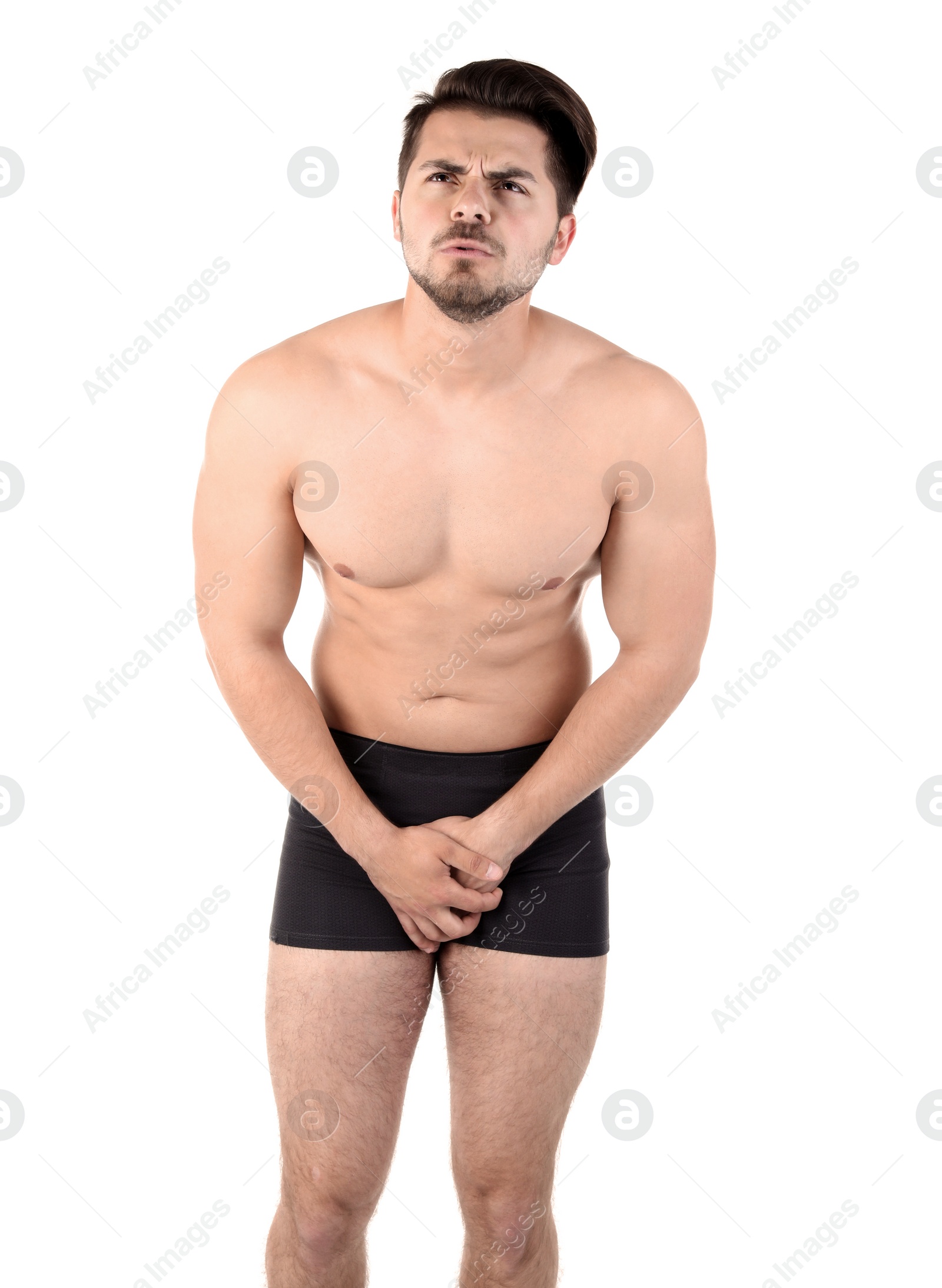 Photo of Young man with urological problems suffering from pain on white background