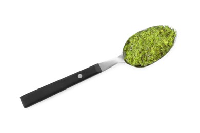 Spoon with delicious pesto sauce isolated on white, top view