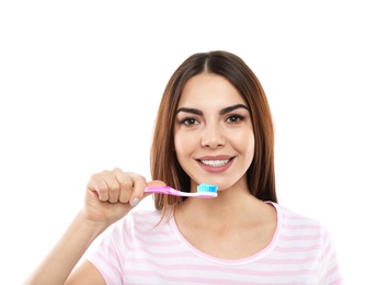 Photo of Beautiful woman brushing teeth on white background