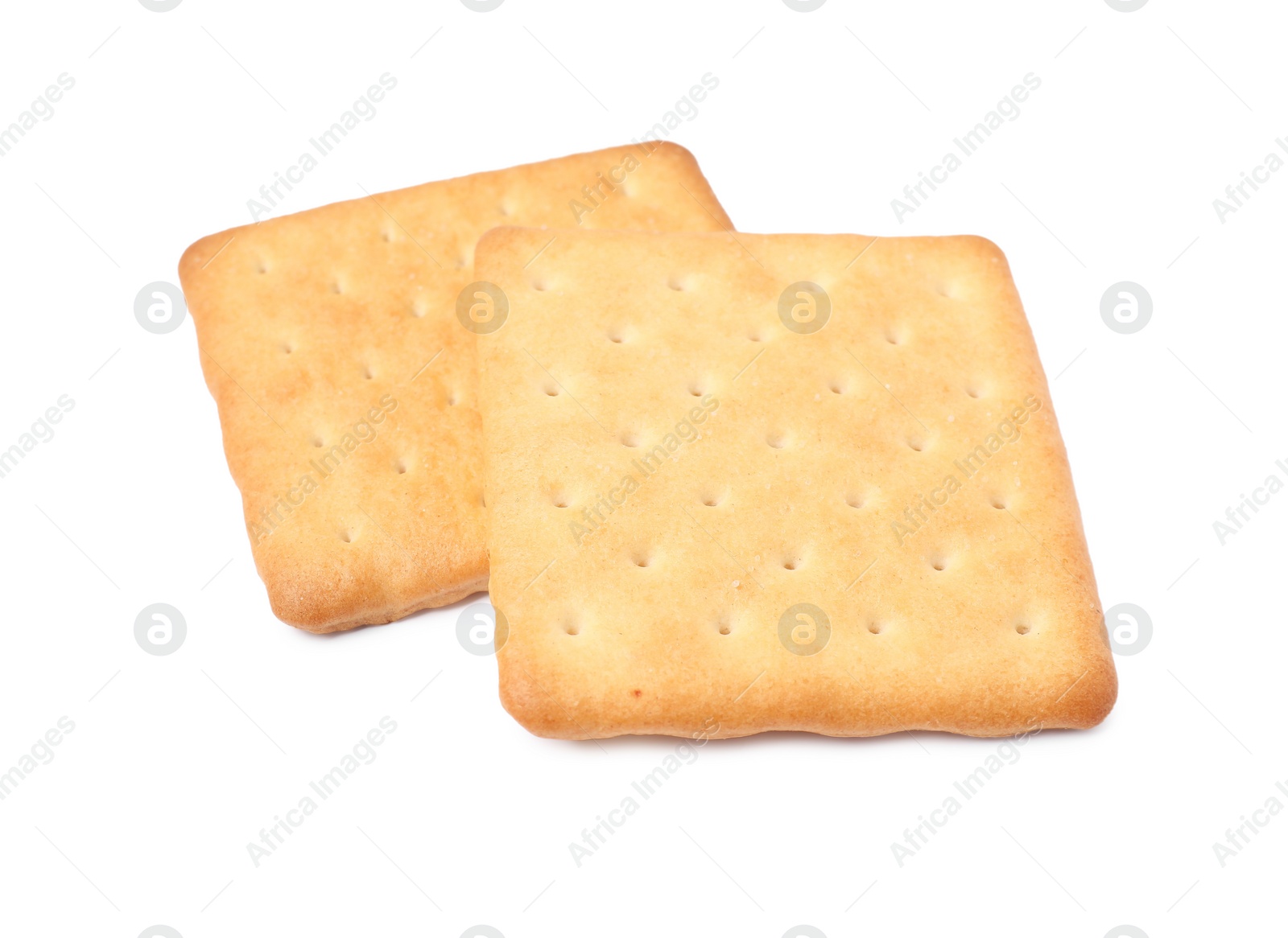 Photo of Two crispy crackers isolated on white. Delicious snack