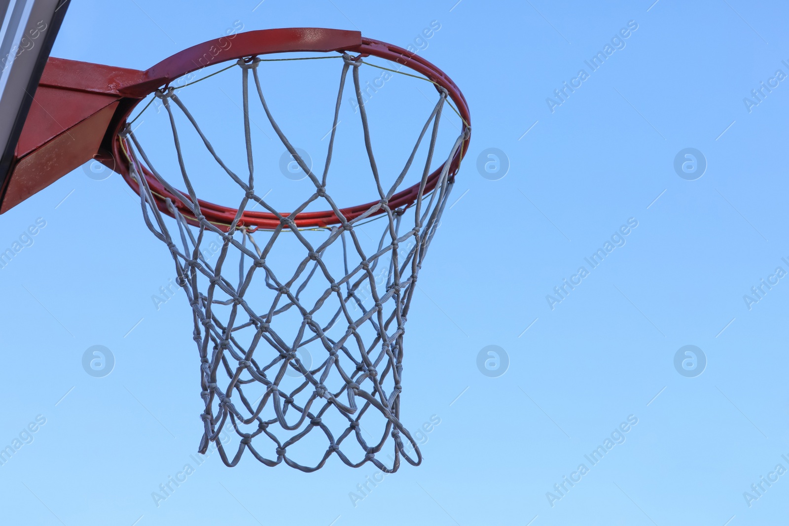 Photo of Basketball hoop with net outdoors, space for text