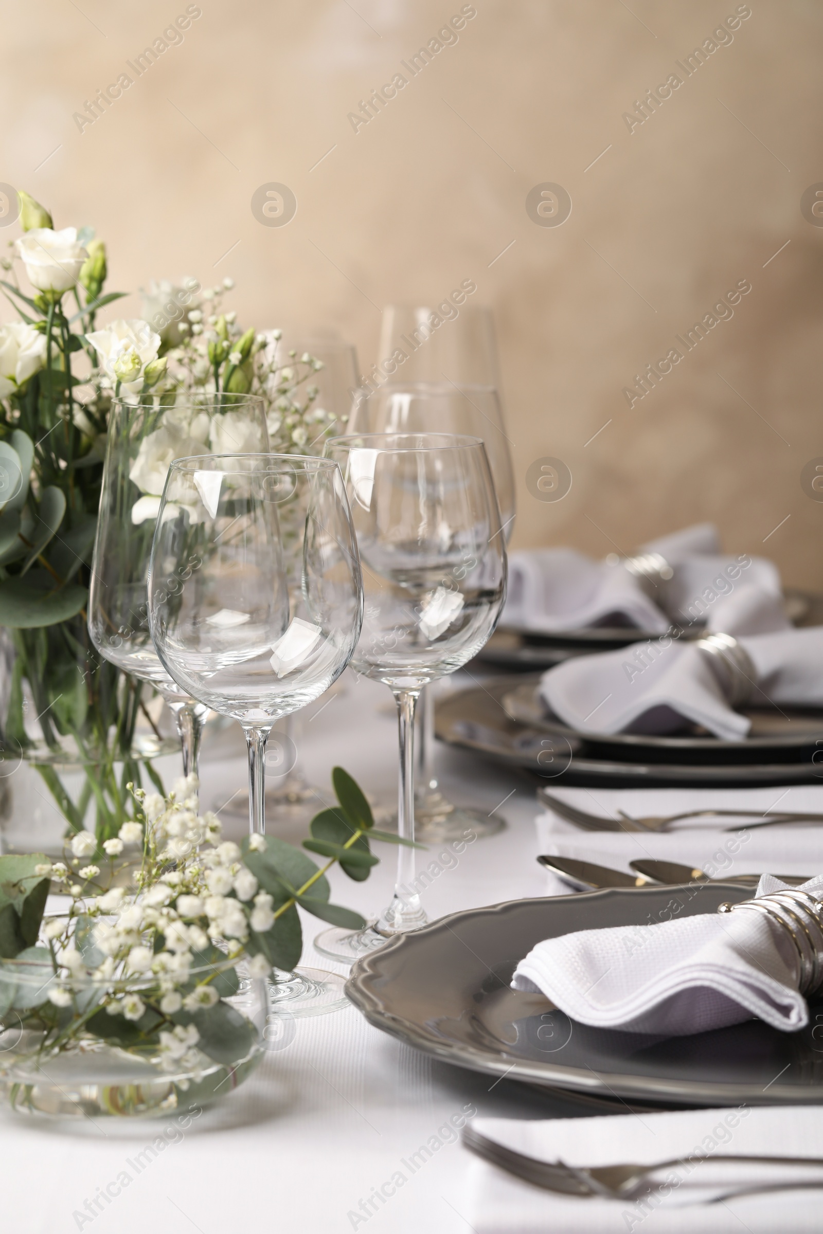 Photo of Stylish elegant table setting for festive dinner in restaurant