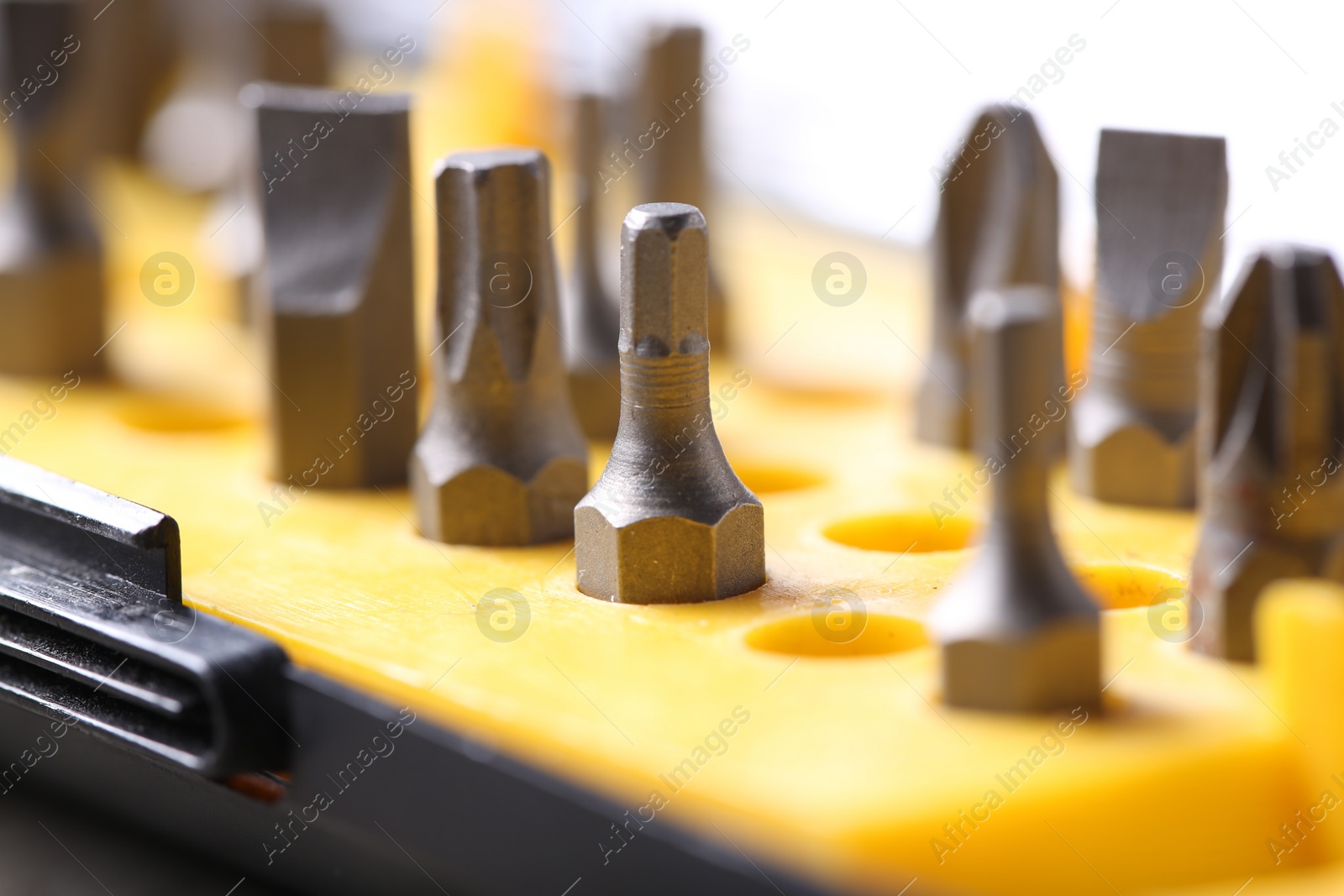 Photo of Screwdriver bit set on blurred background, closeup