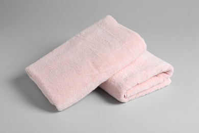 Fresh soft folded towels on light background