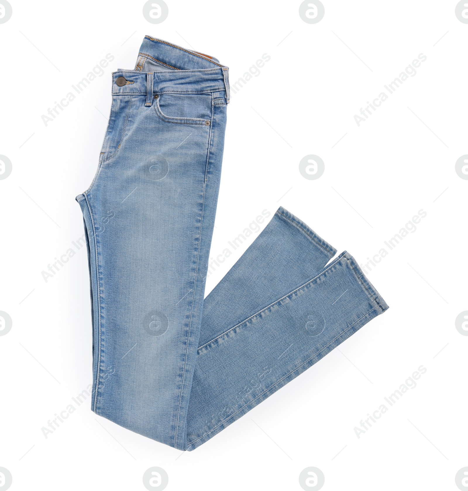 Photo of Stylish light blue jeans isolated on white, top view