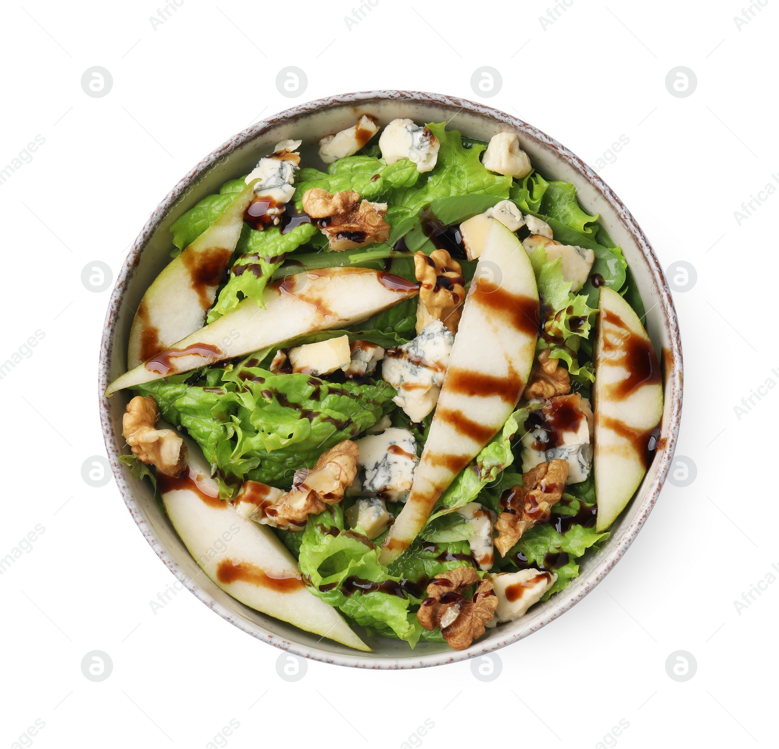 Photo of Delicious pear salad with sauce in bowl isolated on white, top view