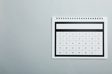 Paper calendar on light grey background, top view. Space for text