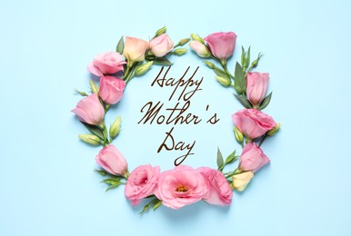 Image of Happy Mother's Day. Beautiful eustoma flowers on light blue background, flat lay