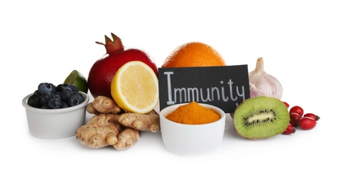 Photo of Set of natural products and card with word Immunity on white background