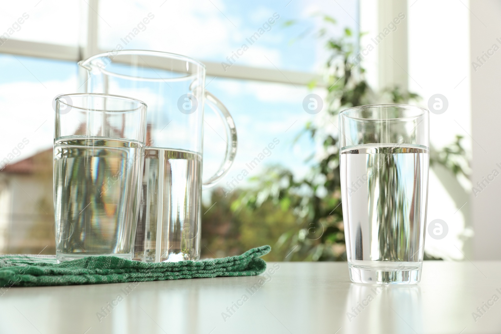 Photo of Glassware of fresh water on table indoors