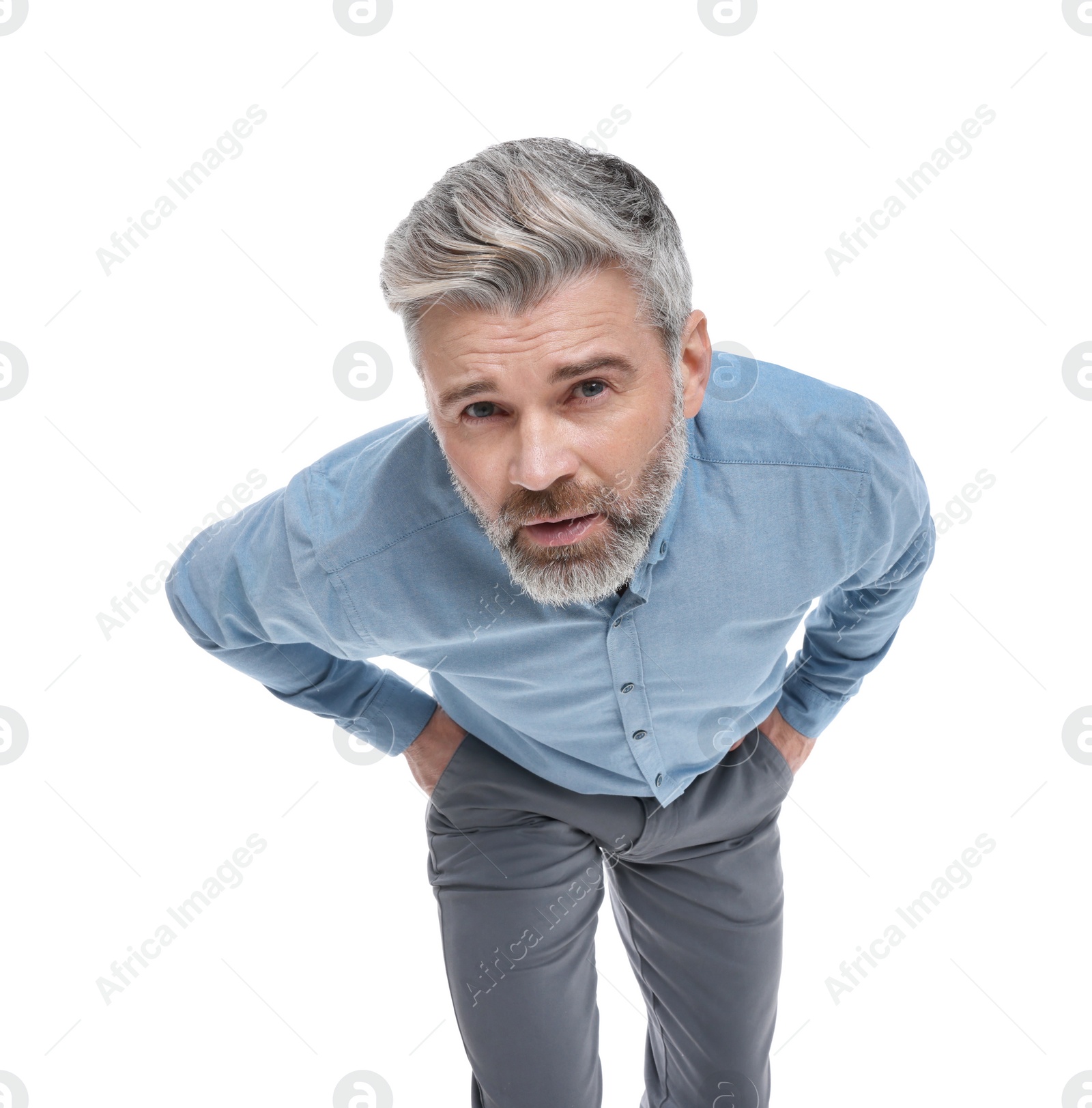 Photo of Mature businessman in stylish clothes posing on white background