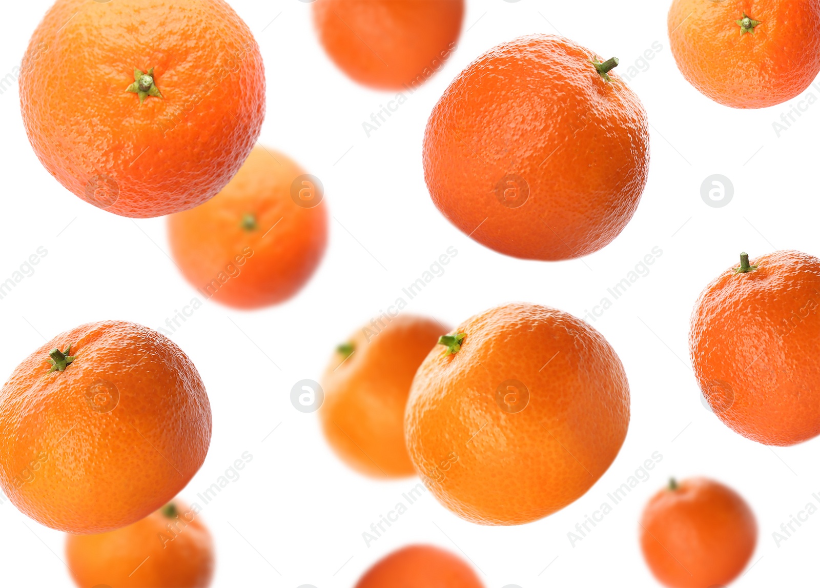 Image of Fresh ripe tangerines falling on white background