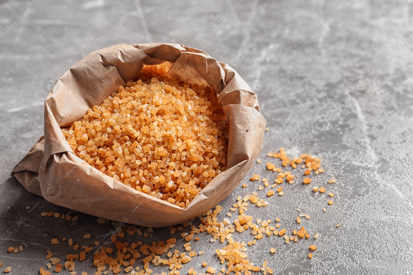 Photo of Bag with brown sugar on table