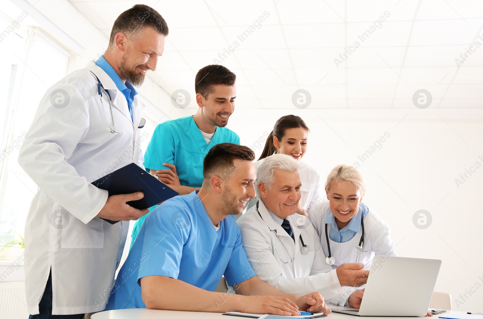 Photo of Group of doctors attending meeting in clinic. Cardiology conference