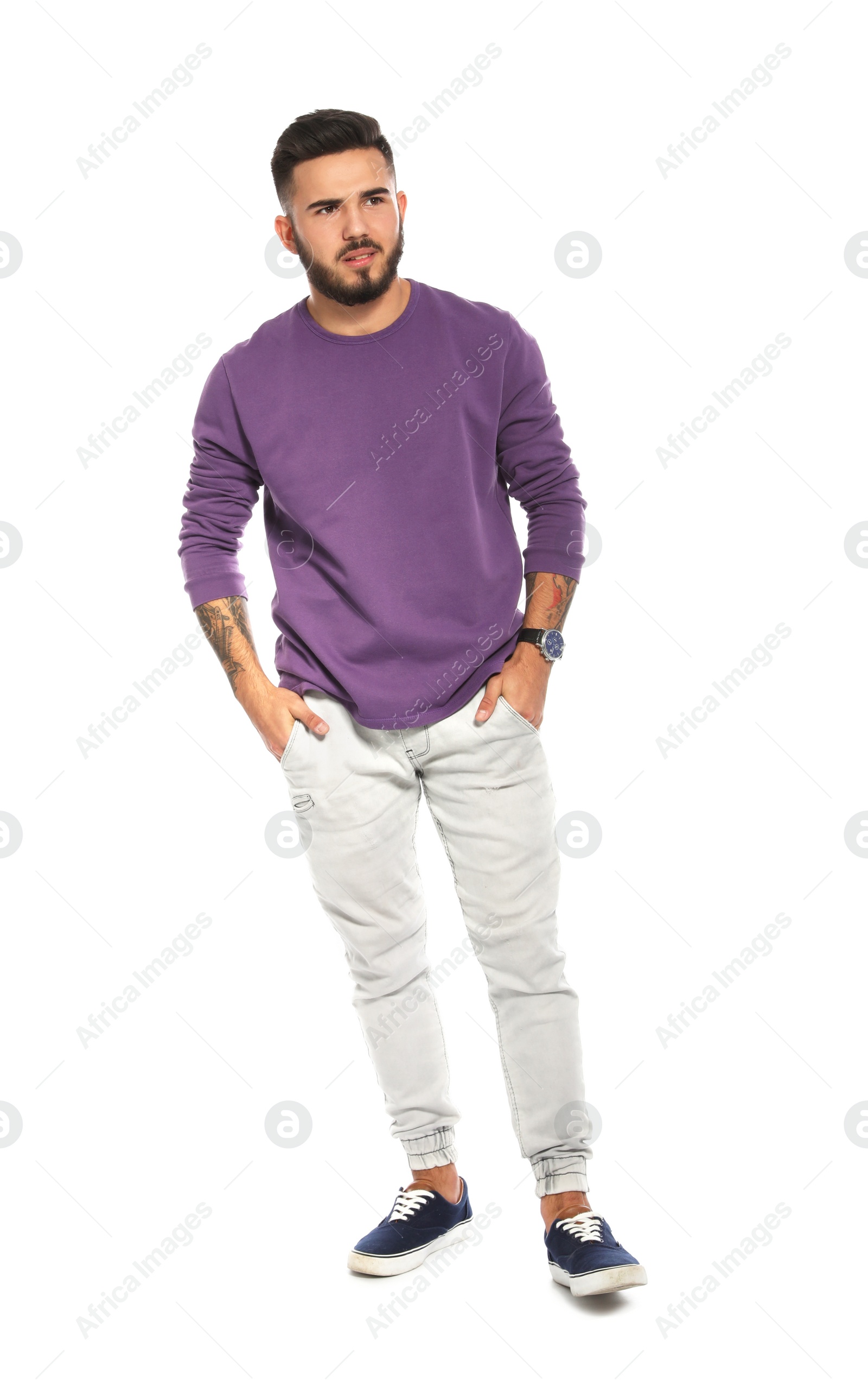 Photo of Handsome young man posing on white background