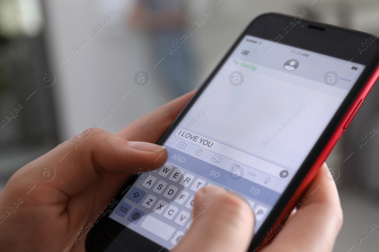 Photo of Woman sending message with text I Love You indoors, closeup