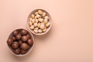 Photo of Delicious organic Macadamia nuts on beige background, flat lay. Space for text