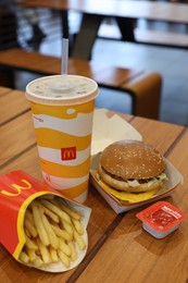 Lviv, Ukraine - October 9, 2023: McDonald's menu on wooden table in restaurant