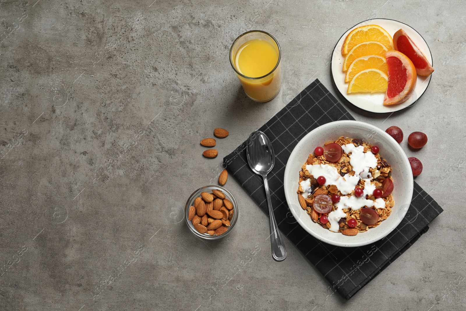 Photo of Tasty healthy breakfast served on grey table, flat lay. Space for text