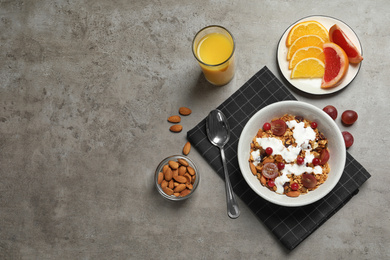 Tasty healthy breakfast served on grey table, flat lay. Space for text