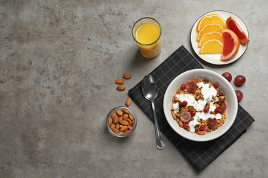 Photo of Tasty healthy breakfast served on grey table, flat lay. Space for text