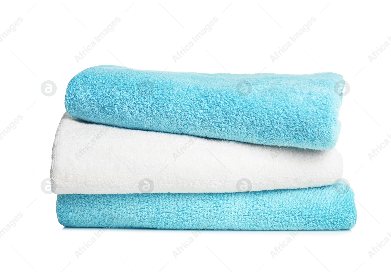 Photo of Folded soft terry towels on white background