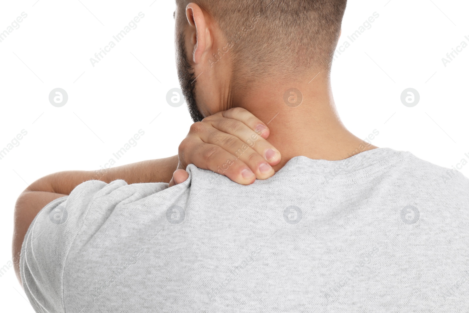 Photo of Man suffering from neck pain on white background, closeup