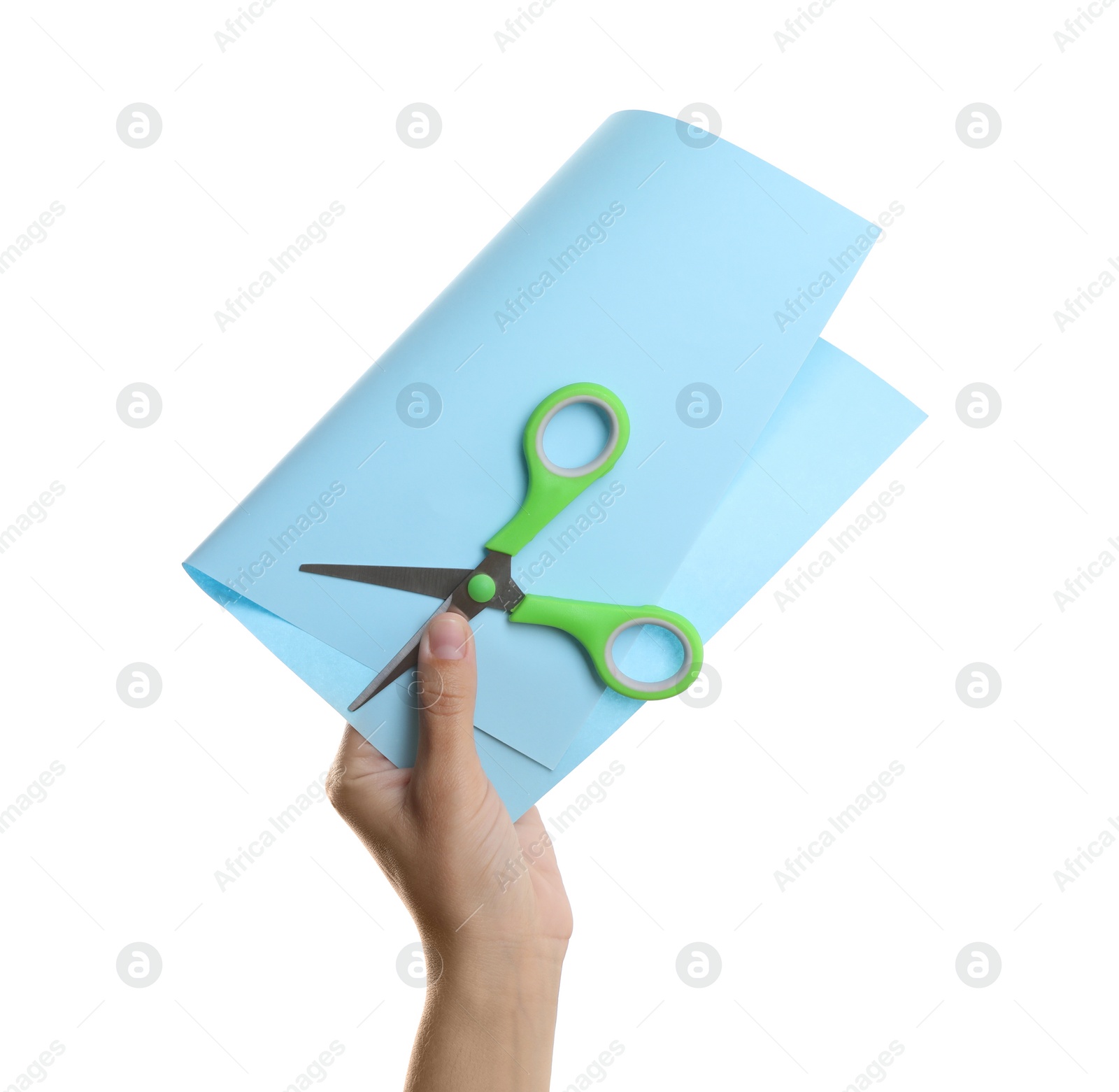 Photo of Woman holding light blue paper and scissors on white background, closeup