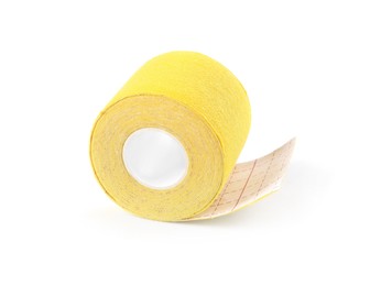 Yellow kinesio tape in roll on white background