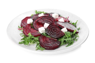 Photo of Roasted beetroot slices with feta cheese and arugula isolated on white