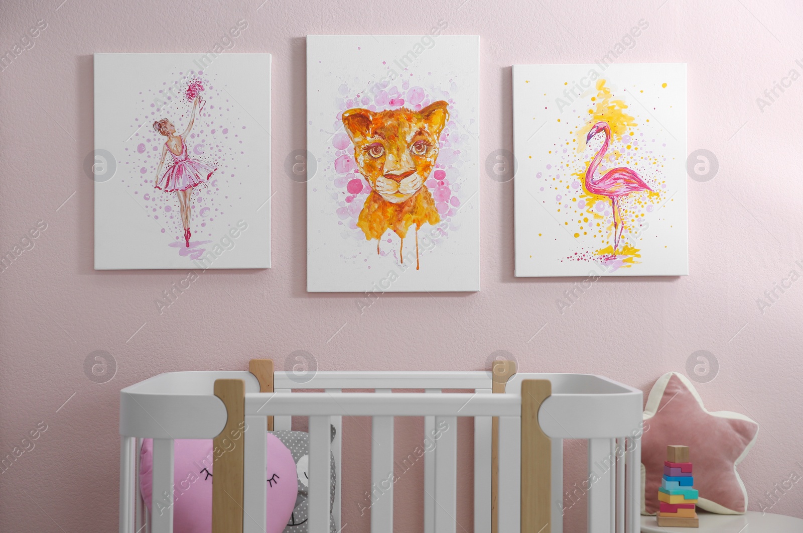 Photo of Cute pictures and crib in baby room interior