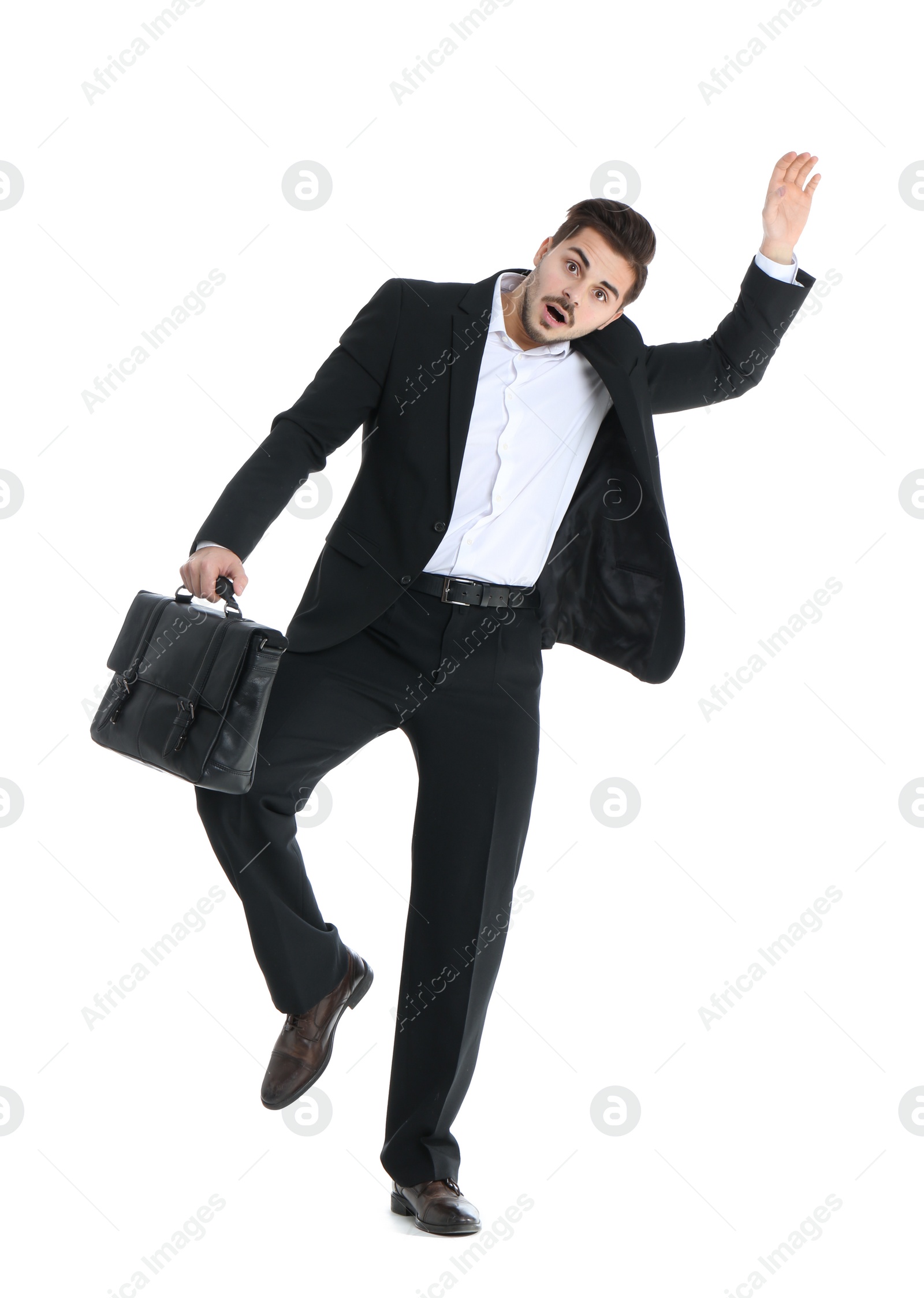 Photo of Young businessman attracted to magnet on white background