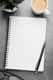 Photo of Flat lay composition with notebook on grey table